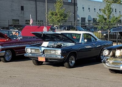 Several vintage cars in a row