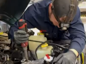 Technician working on vehicle