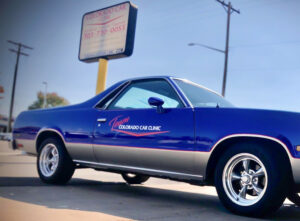 Colorado Car Clinic logo on blue car